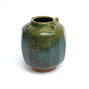 Photograph: Green vase with cut sides, pierced lugs and incised decoration on the shoulder, Bernard Leach, 1925-6. KM 1394