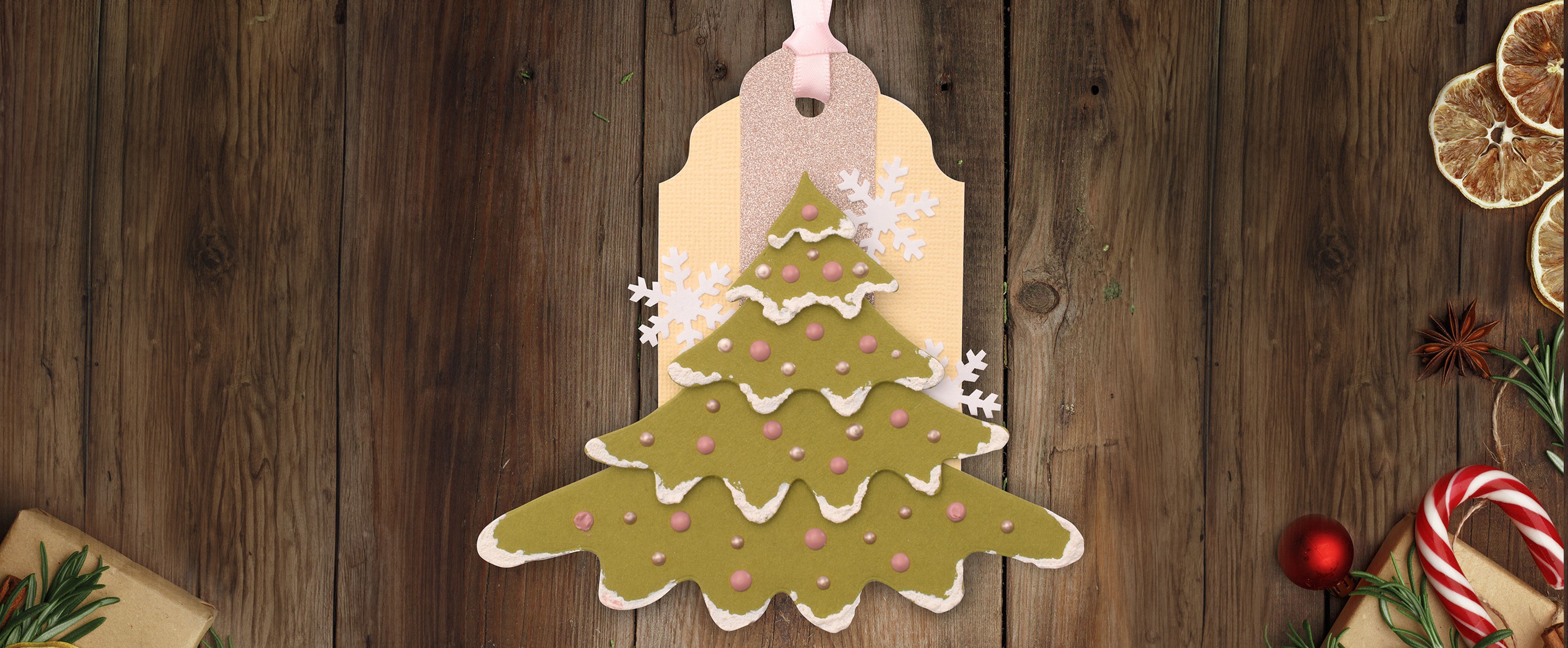 Christmas gift tag with a Christmas tree design, made from kraft paper and white cardstock, decorated with punched stars and mini-label.