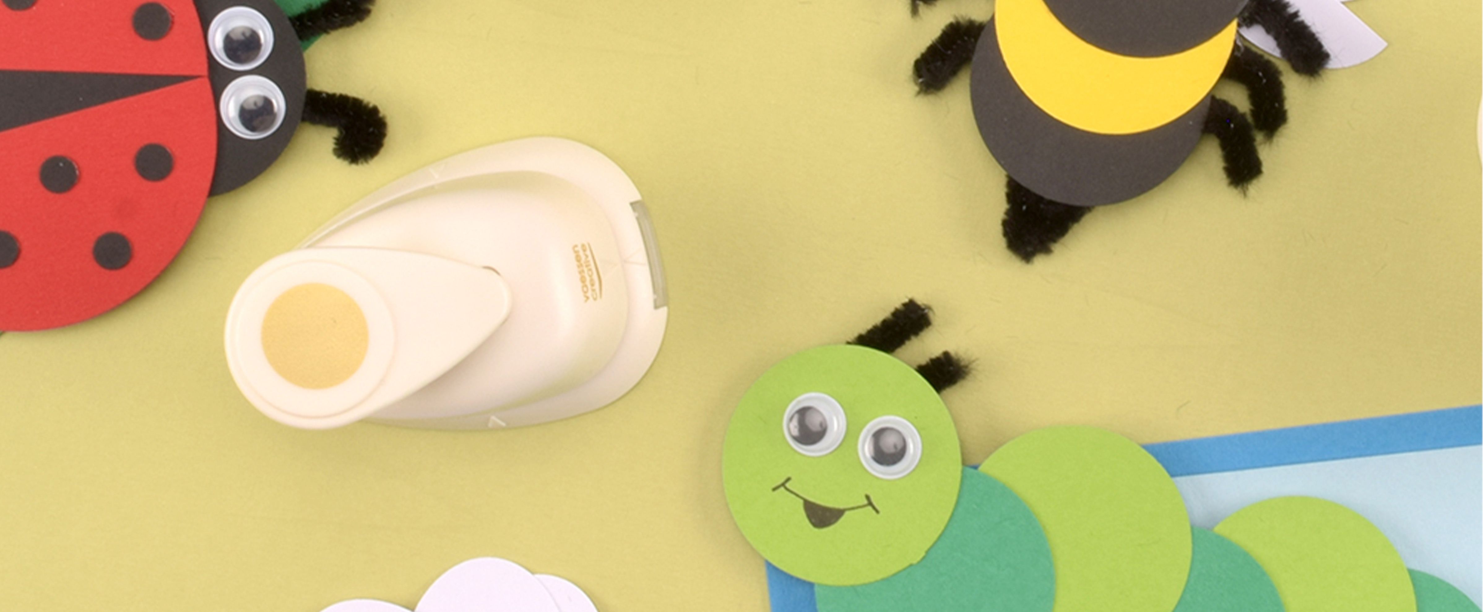 Crafting with preschoolers: colourful paper animals with punches, googly eyes and chenille stems.