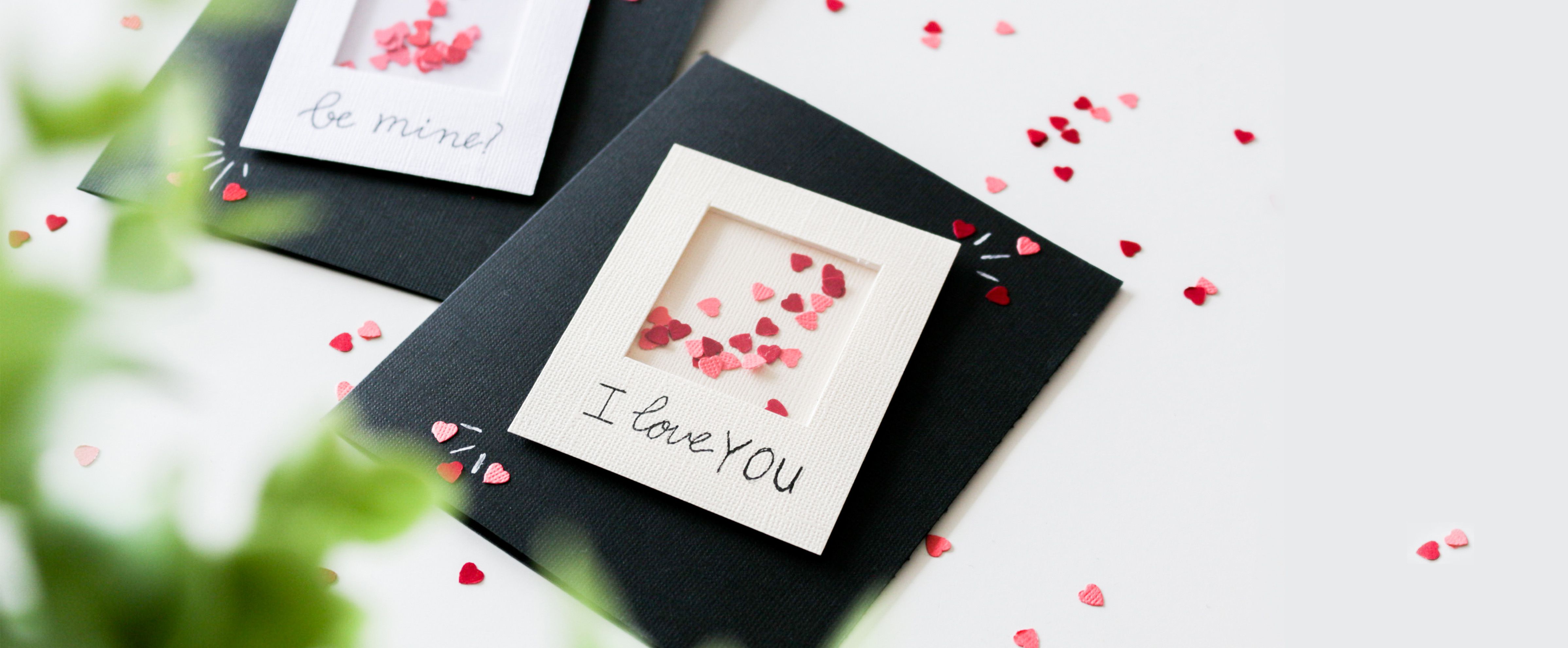 Shaker card with a Polaroid design for Valentine’s Day featuring small heart-shaped confetti.
