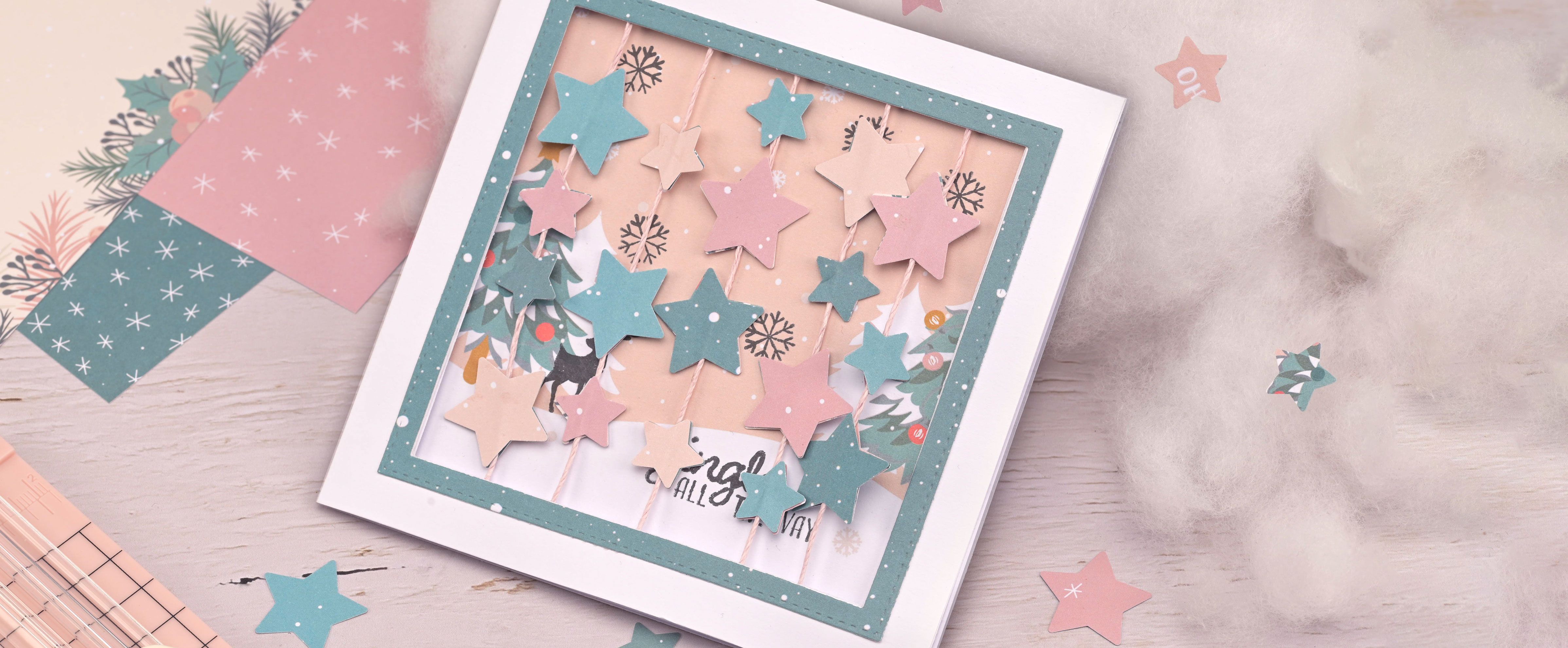 Biglietto di Natale con stelle rotanti — biglietto interattivo fatto a mano con elementi mobili.