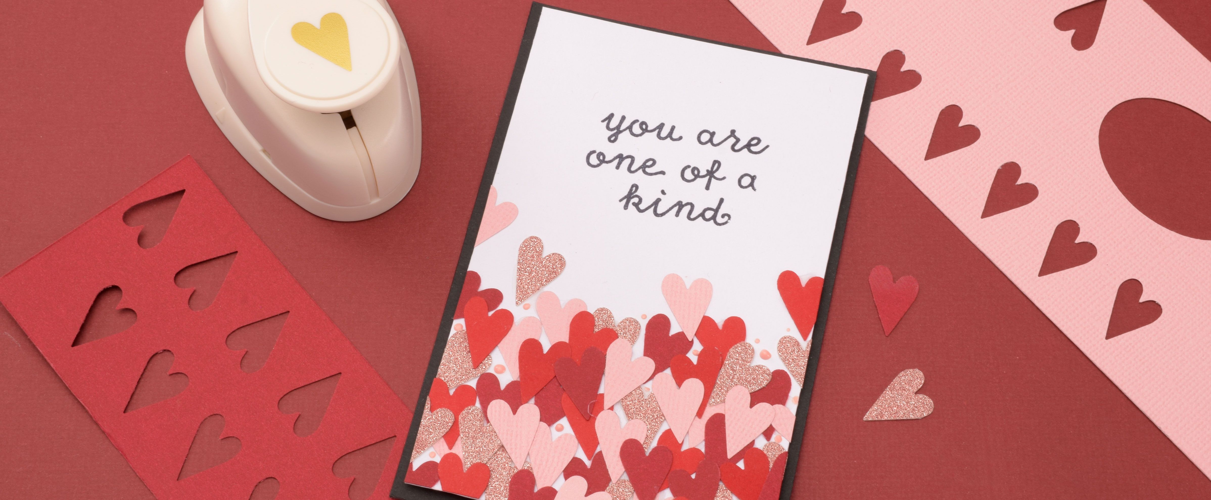 Valentine’s card with heart shapes and the text "You’re one of a kind" in a playful design.