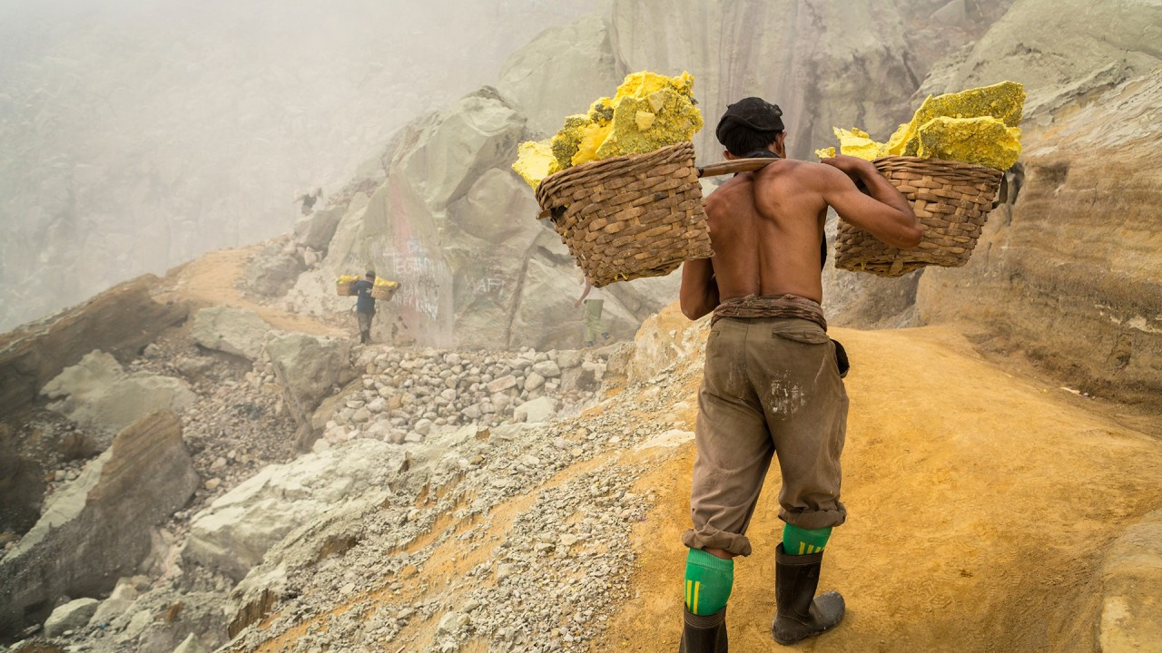 Man carrying baskets of phosphorous