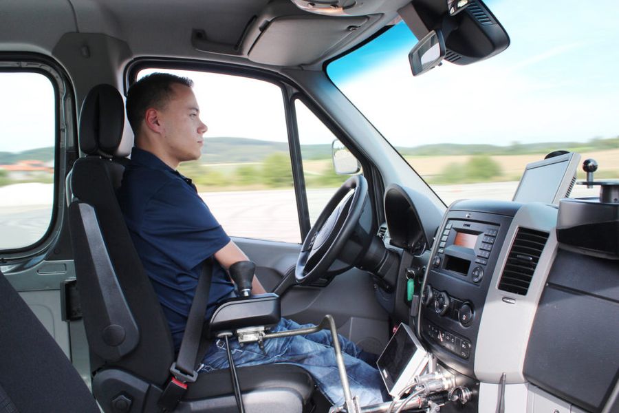 Mr Balušík using the joystick-adjusted car