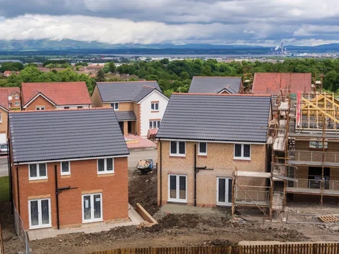 Taylor Wimpey swings to first-half loss and cuts dividend featured picture