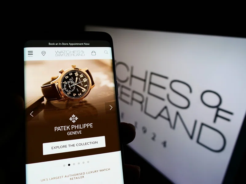 Watches of Switzerland logo on a smartphone