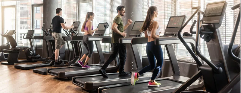 people on treadmills at the gym
