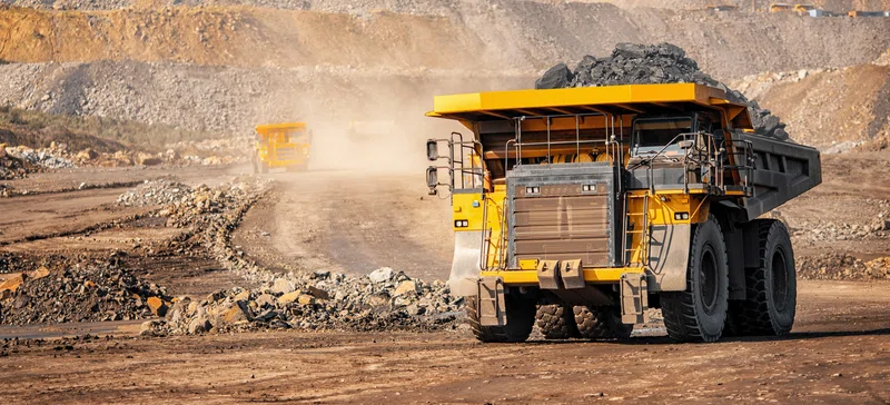 Yellow truck at open pit mine