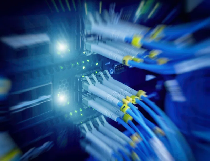 Cables plugged in to back of datacentre computers