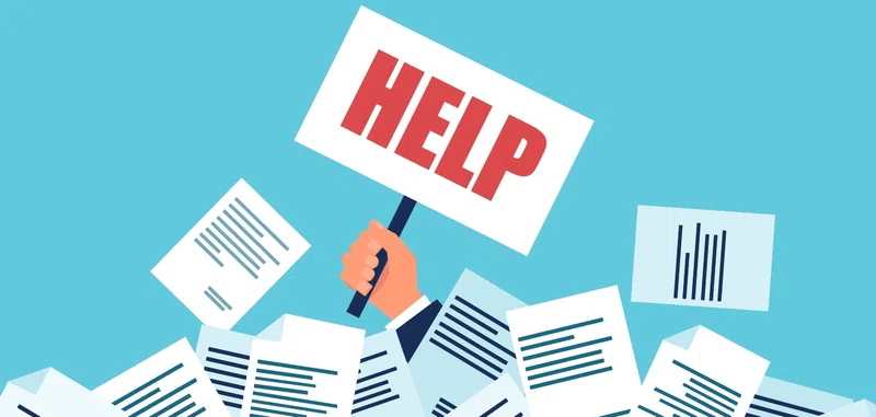 A person drowning in paperwork