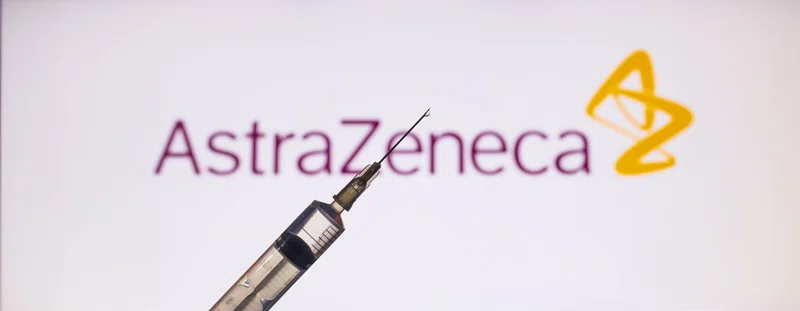 needle in front of Astra Zeneca logo