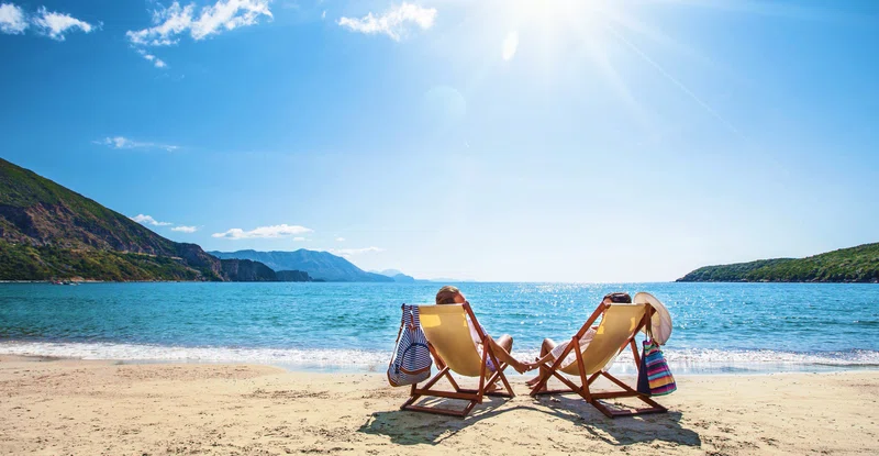 A couple sitting on the beach