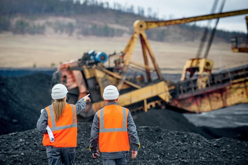 Miners pointing into the distance