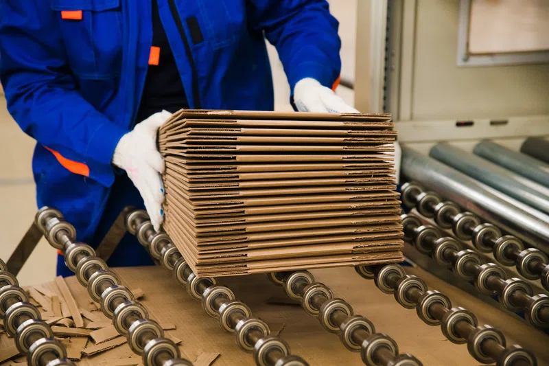 Boxes being collected on assembly line