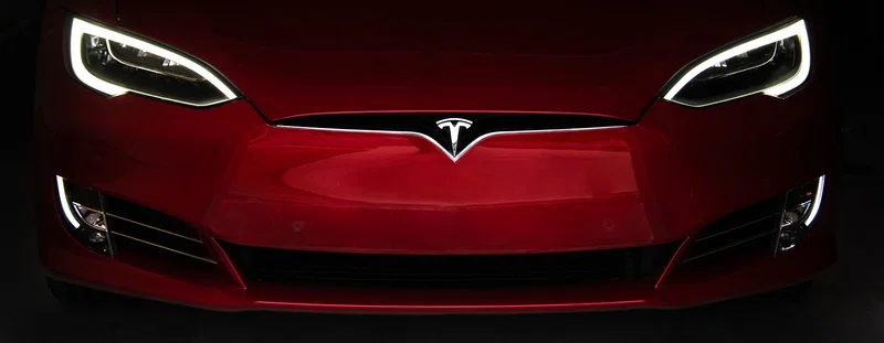 front of Tesla