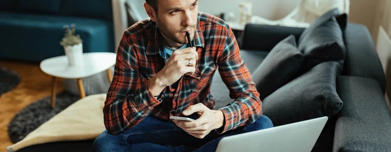 thinking at a laptop