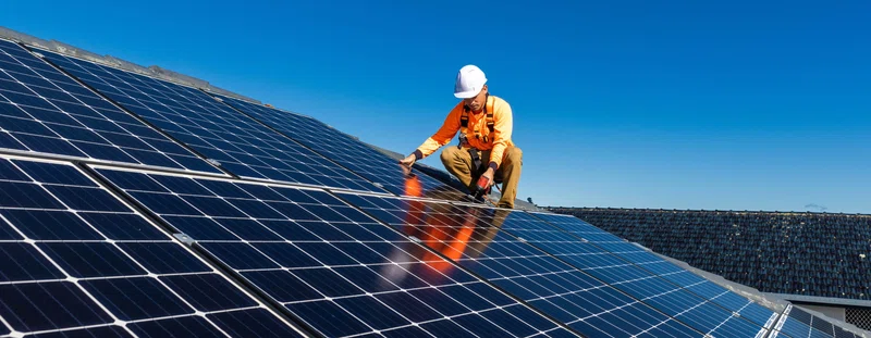 man on solar panel