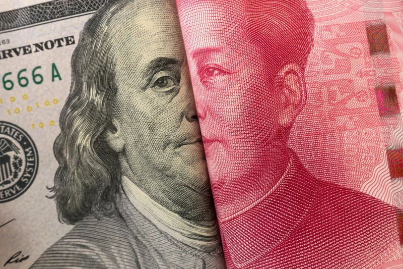 Dollar bill and Chinese yuan note