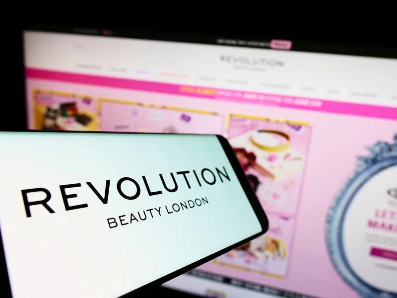 Revolution Beauty logo on a smartphone