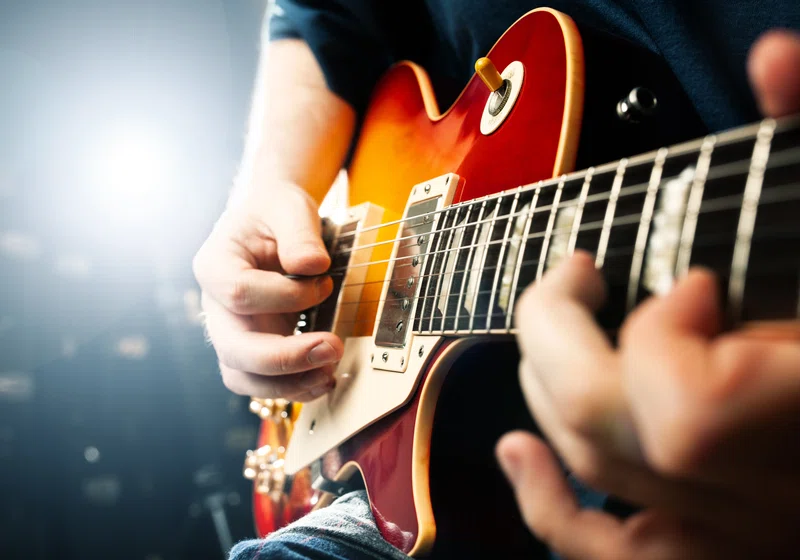 Person playing the guitar