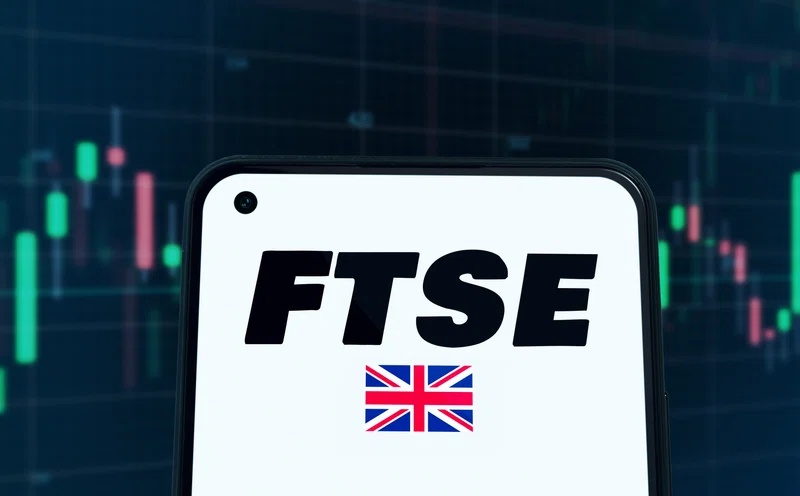 FTSE 100 sign with UK flag