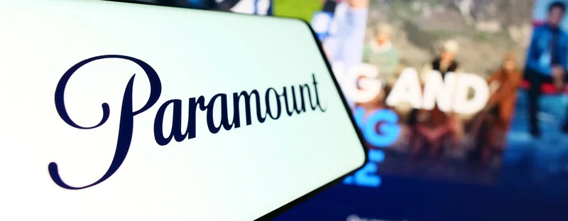 A phone with the paramount logo showing and a television with paramount home screen