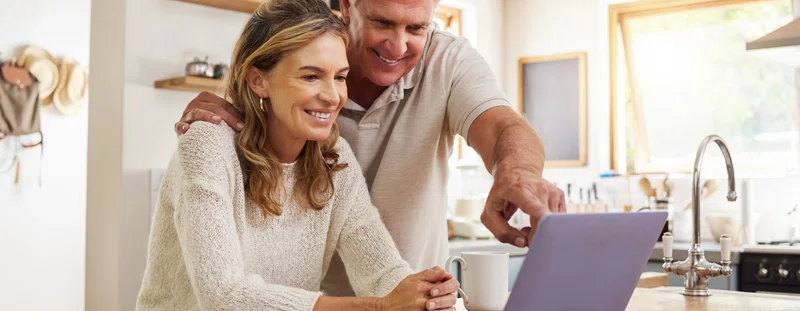 Couple looking at a laptop screen