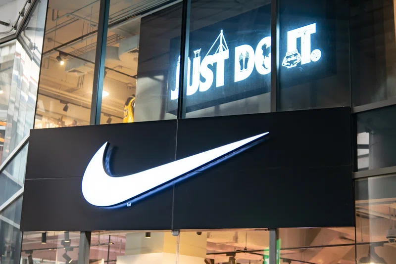Nike Swoosh logo in front of store