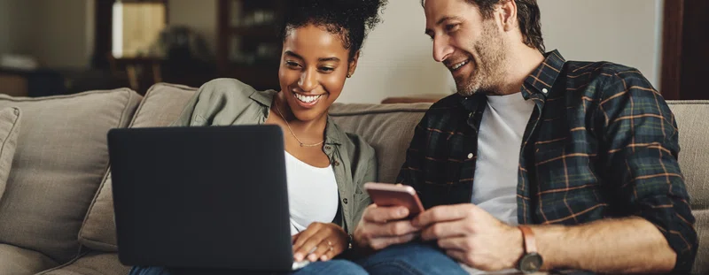 Couple looking at laptop