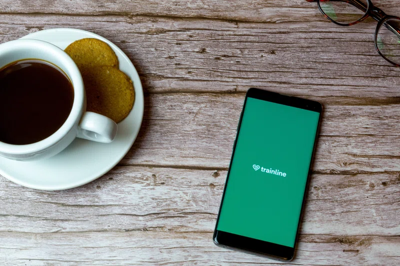 A cup of coffee and a Trainline app