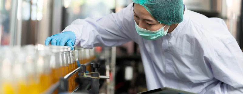 Factory worker checking products