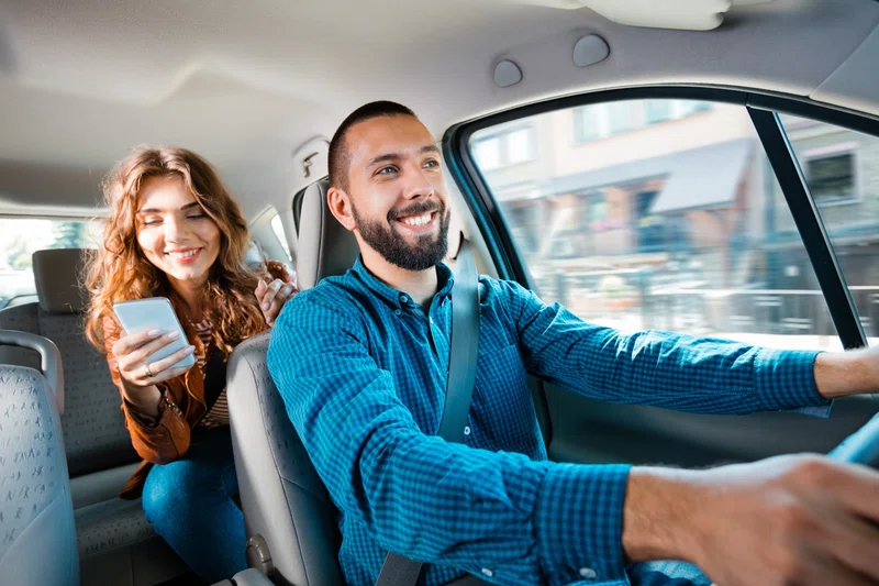 Woman in back of Uber car