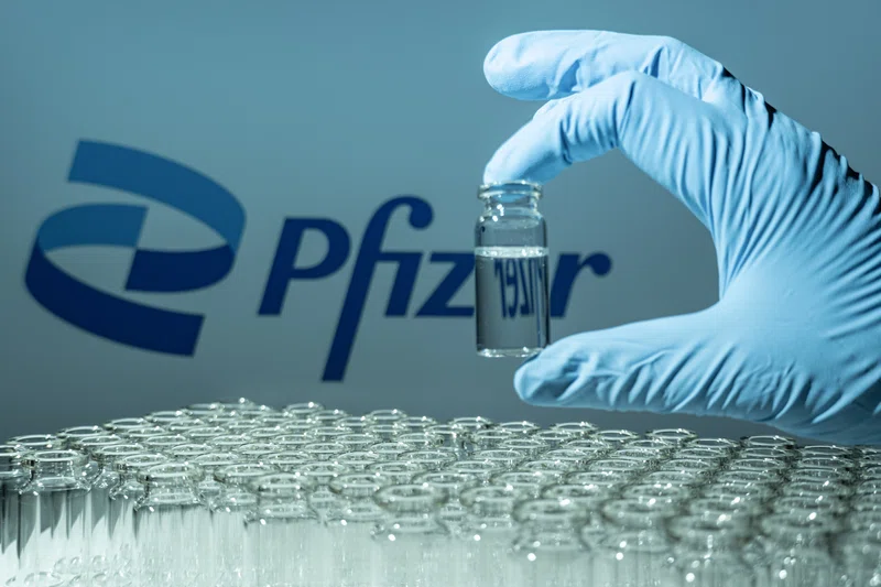 Test tube samples with Pfizer logo in background