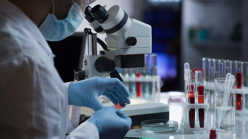Laboratory technician working with test tubes
