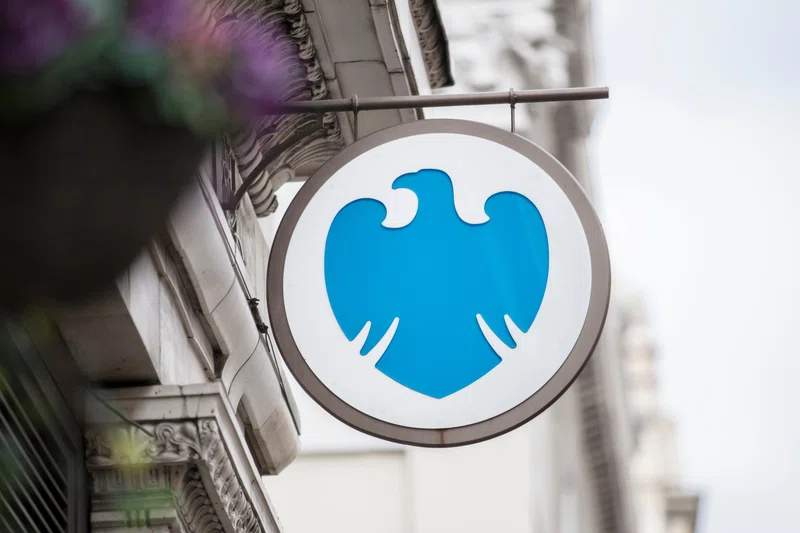 Barclays logo on building at night