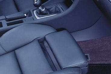 The car seat has been extended on slides for upper leg adjustment.