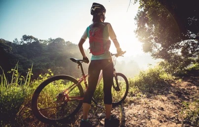 young-woman-cyclist-enjoy-beautiful-260nw-1676914135.webp