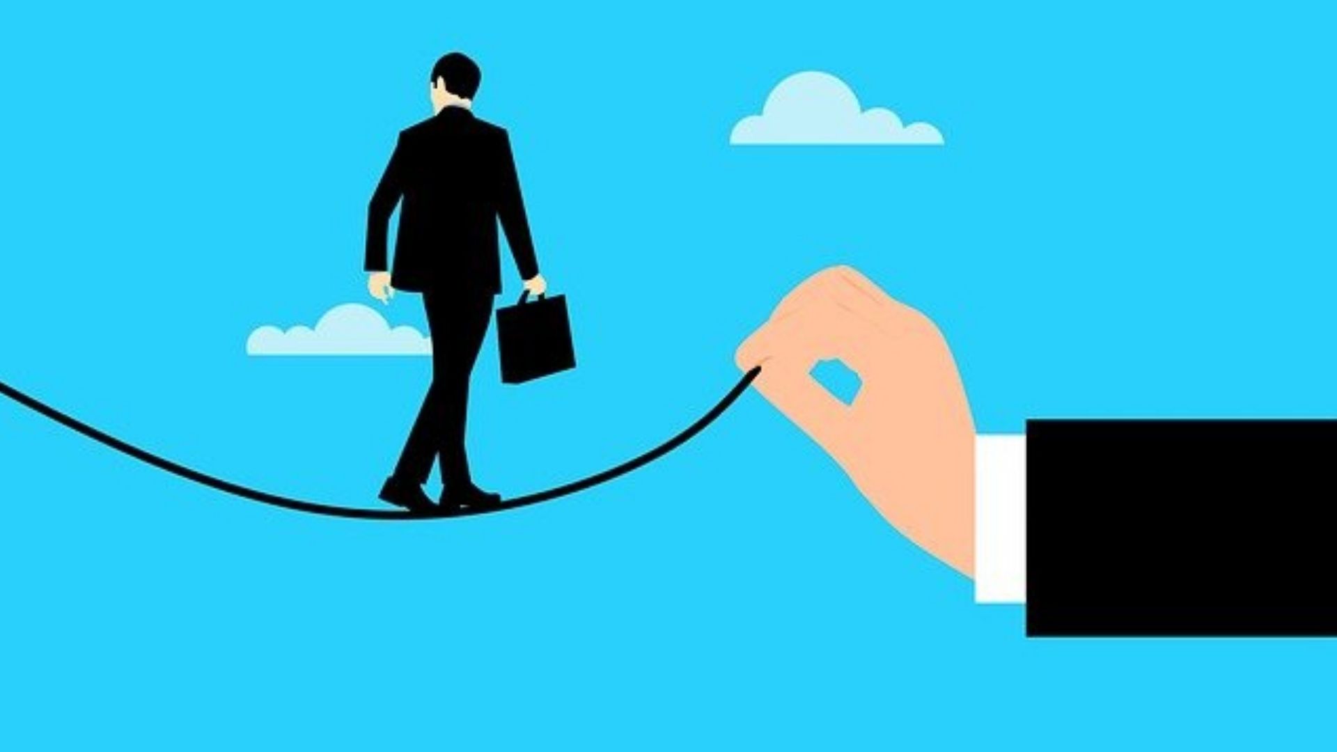 Homme en costume qui marche sur un fil tenu par une main symbolisant l'entreprise pour évoquer la mobilité interne en entreprise. 