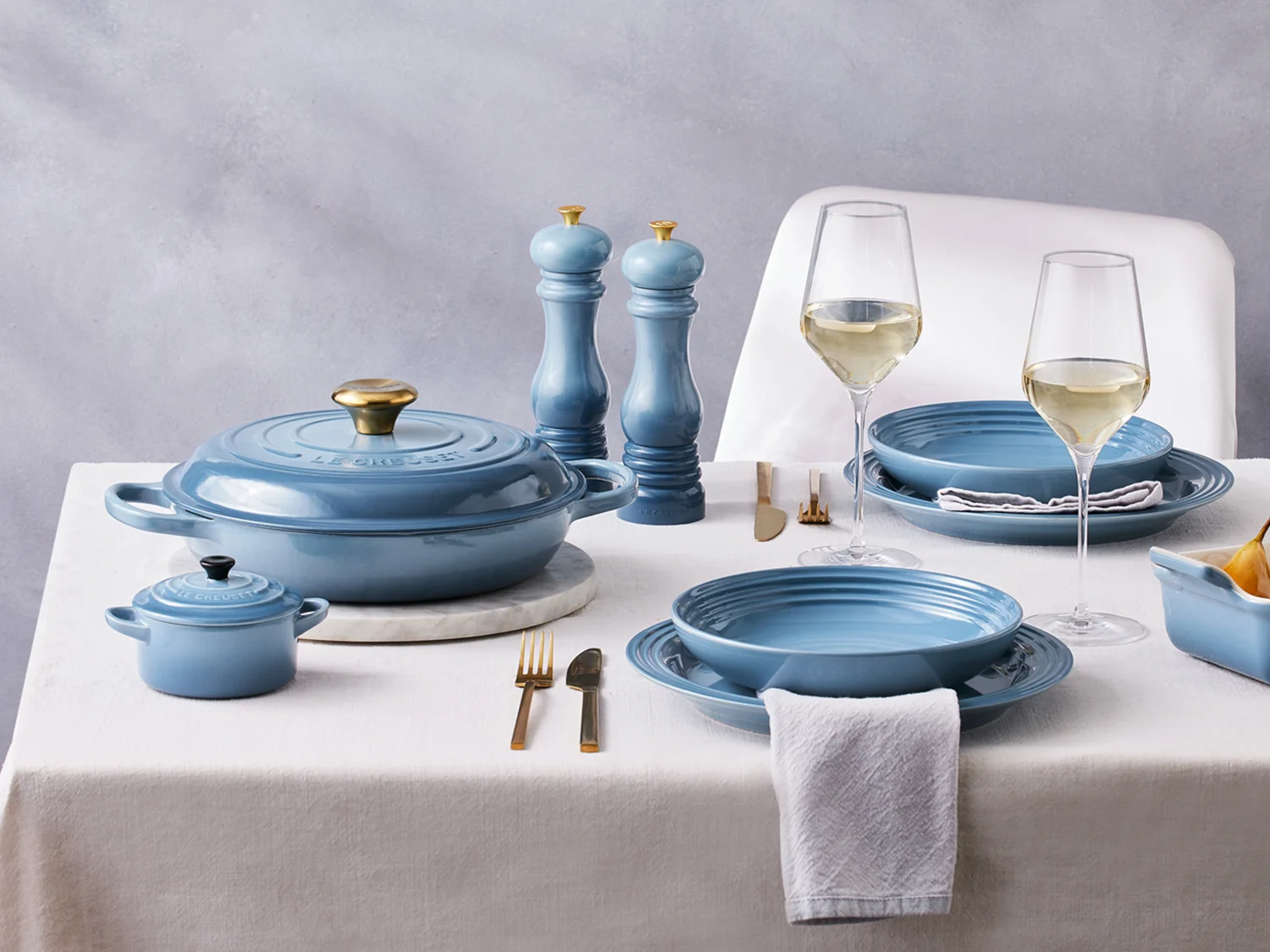 le creuset chambray collection on dining table