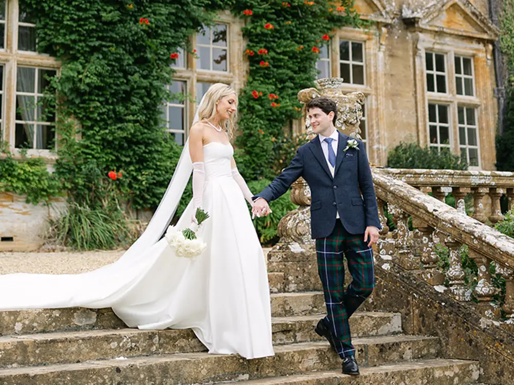 Newlyweds during their Grade I listed manor house wedding at Brympton House